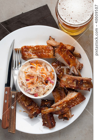 Grilled pork ribs in barbecue sauce. 48609587