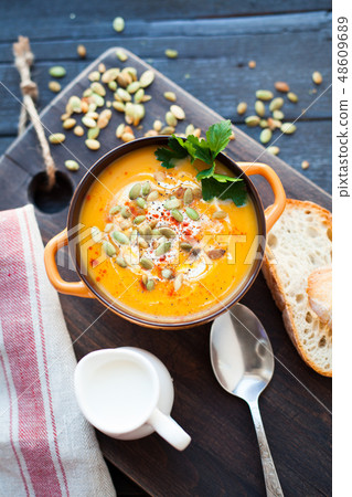 Homemade pumpkin soup with cream. 48609689