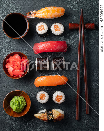 Set of sushi and maki on stone table. 48609693