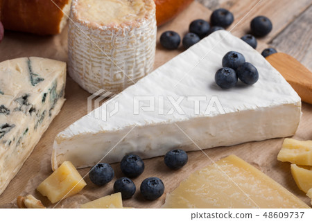 Tasting cheese dish on a wooden background. 48609737