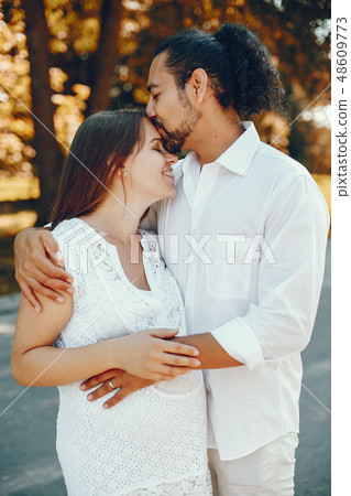 Wife with her husband in a summer park Wife with her husband in a summer park 48609773