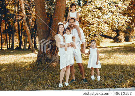 Big family playing in a summer park 48610197