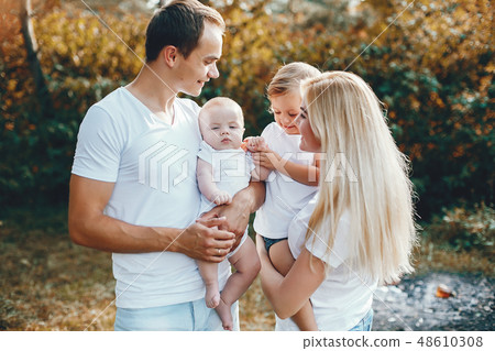 Cute family playing in a summer park 48610308