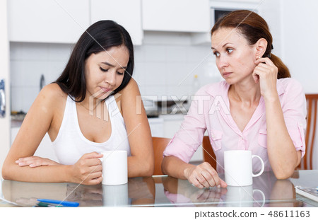 Mother and daughter having dialog Mother and daughter having dialog 48611163