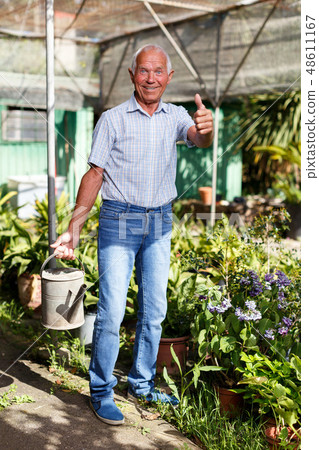 Older man proud of his garden Older man proud of his garden 48611167