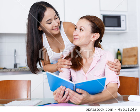 Woman rejoicing of daughter Woman rejoicing of daughter 48611249