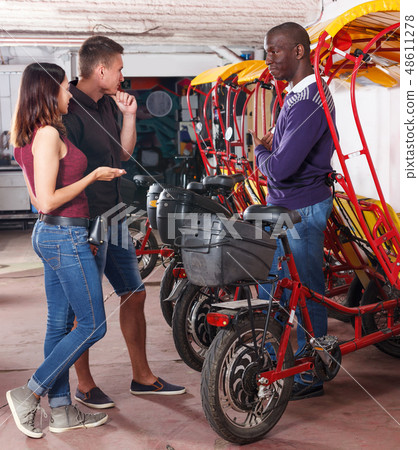 Positive couple planning to hire velotaxi Positive couple planning to hire velotaxi 48611278