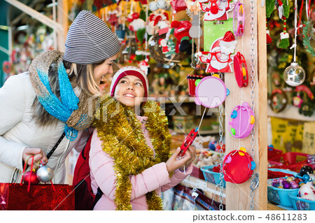 Female customers staring at counter of Christmas market 48611283