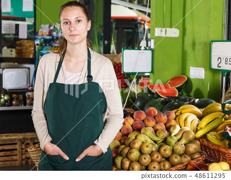 Saleswoman posing in fruit market 48611295