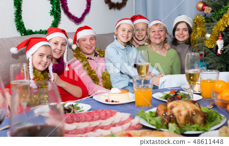 Family is posing together in time celebration New Year Family is posing together in time celebration New Year 48611448