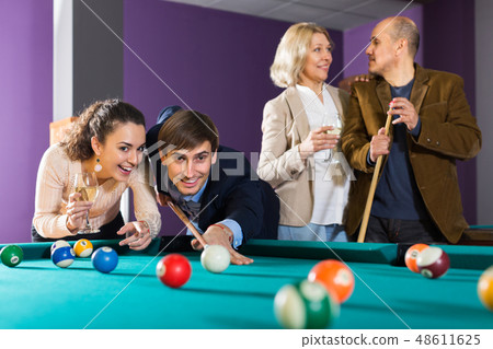 People playing billiard 48611625