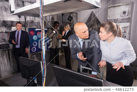 Businesspeople in escape room stylized under laboratory Businesspeople in escape room stylized under laboratory 48612273