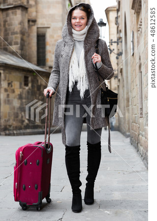 girl teenager with baggage outdoors 48612585
