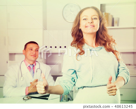 Doctor and pregnant visitor Doctor and pregnant visitor 48613245