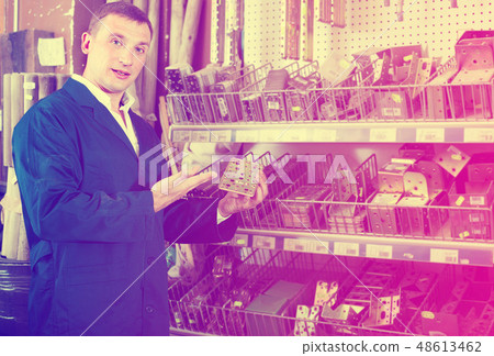 workman holding metal furniture 48613462