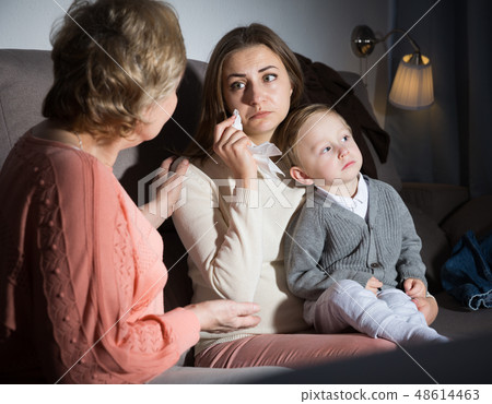 Two adult female are talking about emotional film in evening Two adult female are talking about emotional film in evening 48614463
