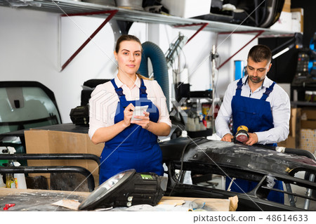 Female mechanic recording list of works Female mechanic recording list of works 48614633