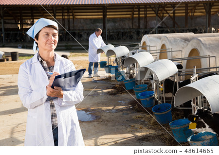 Portrait of woman quality expert who is standing Portrait of woman quality expert who is standing 48614665