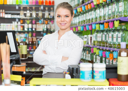 Confident girl sale consultant working in perfume shop Confident girl sale consultant working in perfume shop 48615003