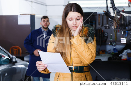 Female is dissatisfied of tire winter replacement of her car Female is dissatisfied of tire winter replacement of her car 48615141