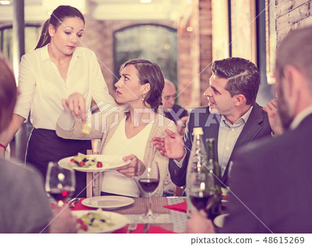 Company expressing dissatisfaction with waitress about food 48615269