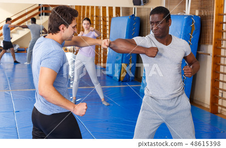 Two men practicing self defense techniques Two men practicing self defense techniques 48615398