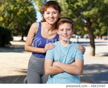 Family in sportswear standing outdoors Family in sportswear standing outdoors 48615497