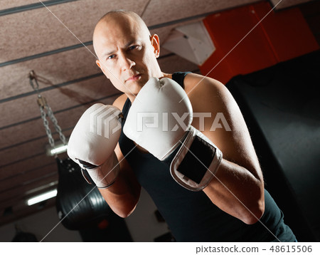 Potrait of man boxer who is training in gym Potrait of man boxer who is training in gym 48615506