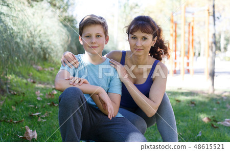 Family in sportswear standing outdoors Family in sportswear standing outdoors 48615521