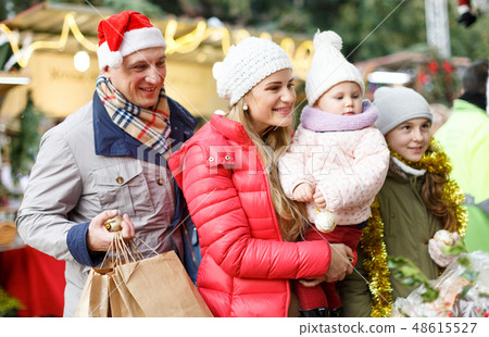 Family spending time at Christmas fair Family spending time at Christmas fair 48615527