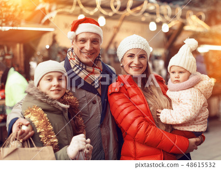 Happy family at Christmas market Happy family at Christmas market 48615532