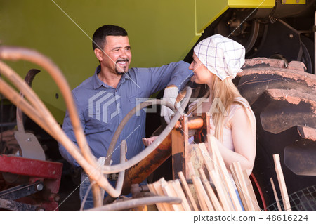 Two farmers near tractor. 48616224