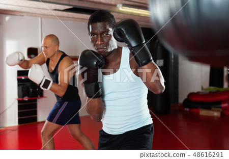 Potrait of african american boxer who is training in gym 48616291