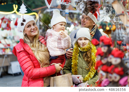 Parents and daughters at Christmas fair Parents and daughters at Christmas fair 48616356