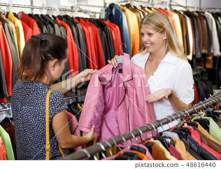 Displeased customer in leather clothes shop Displeased customer in leather clothes shop 48616440