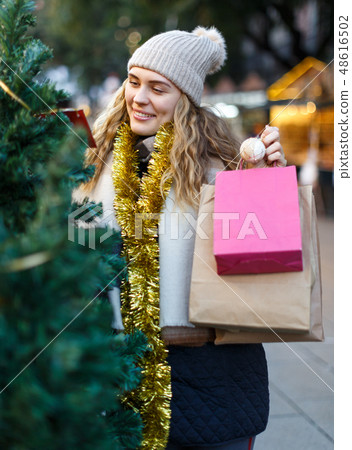 Woman buying Christmas tree 48616502