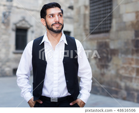 Waist up portrait of man at ancient street Waist up portrait of man at ancient street 48616506