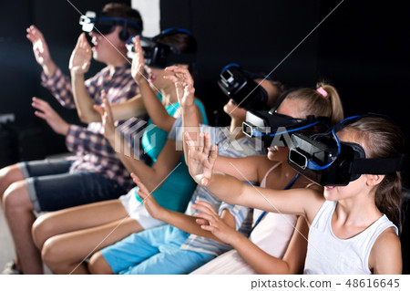 Parents with children are watching video Parents with children are watching video 48616645