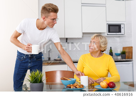 Mother and son having breakfast together Mother and son having breakfast together 48616916