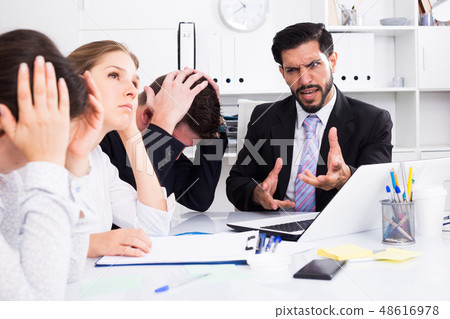 Outraged manager with colleagues at meeting Outraged manager with colleagues at meeting 48616978
