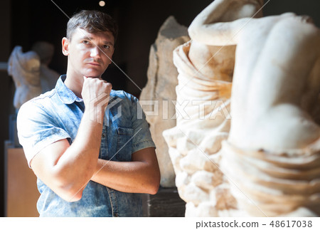 Man visiting sculpture hall Man visiting sculpture hall 48617038