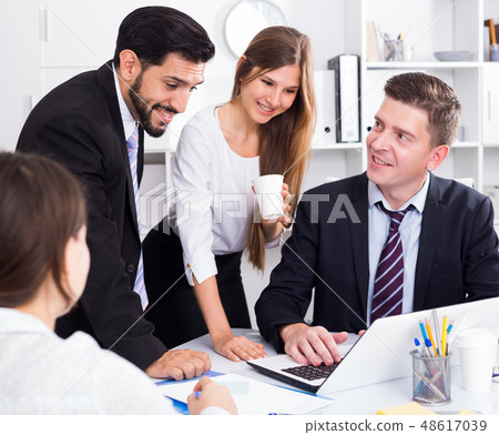 Business partners discussing in office Business partners discussing in office 48617039