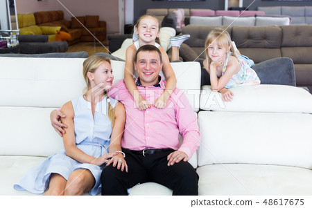 Parents with kids is pleased by new sofa Parents with kids is pleased by new sofa 48617675