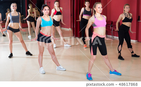 Women are practising slide movement in jazz dance 48617868