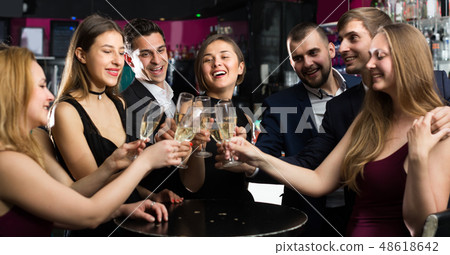 Office workers are drinking sparkling wine Office workers are drinking sparkling wine 48618642