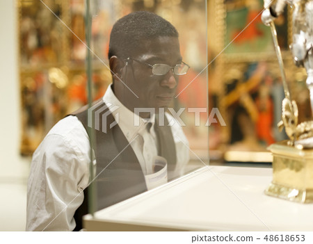 Mature afro man visiting Art Museum Mature afro man visiting Art Museum 48618653