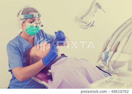 dentist professional filling teeth for man dentist professional filling teeth for man 48618702