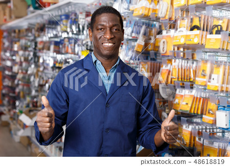 Adult African American seller giving thumbs up Adult African American seller giving thumbs up 48618819