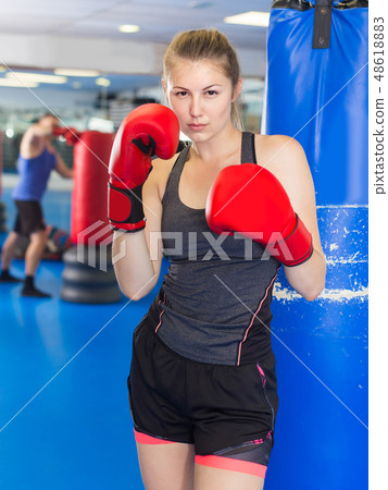 Portrait of woman who is training in box gym. Portrait of woman who is training in box gym. 48618883