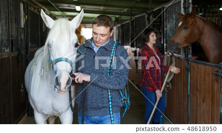 Man in casual clothes who works at stable 48618950